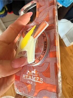 Hermes Orange & White Patterned Phone Case with Yellow Accent Charm